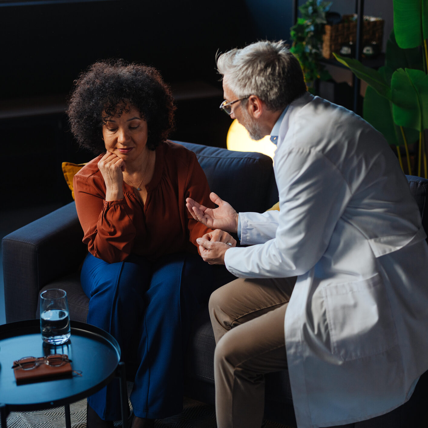 Doctor comforting a worried patient